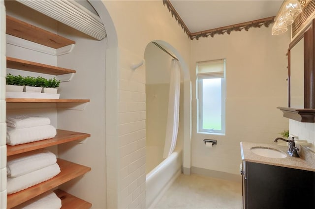 bathroom featuring vanity and shower / tub combo