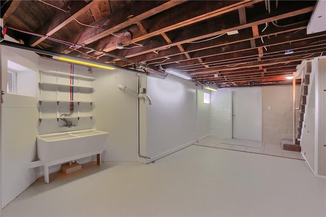 unfinished below grade area with a sink