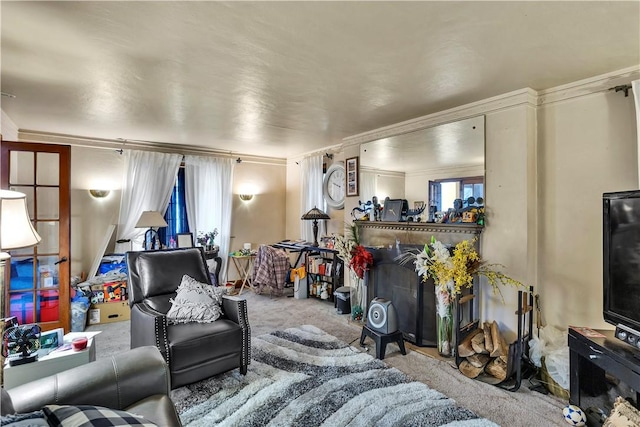 living area featuring carpet flooring and ornamental molding