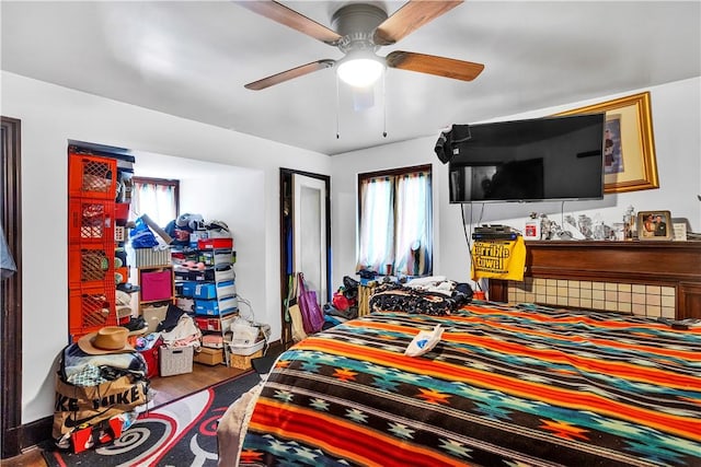 bedroom featuring wood finished floors and ceiling fan