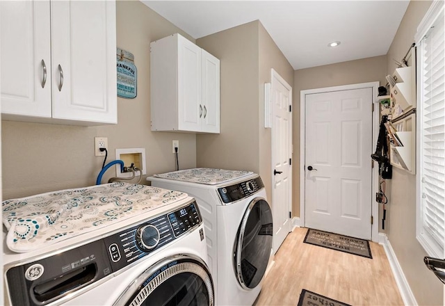 clothes washing area featuring separate washer and dryer, cabinet space, light wood-style flooring, baseboards, and recessed lighting