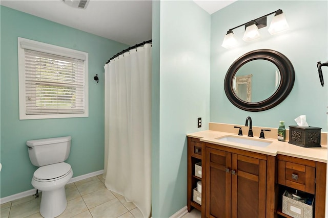 full bathroom featuring toilet, tile patterned floors, baseboards, and vanity