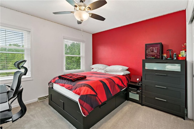 bedroom with carpet flooring, a ceiling fan, and baseboards