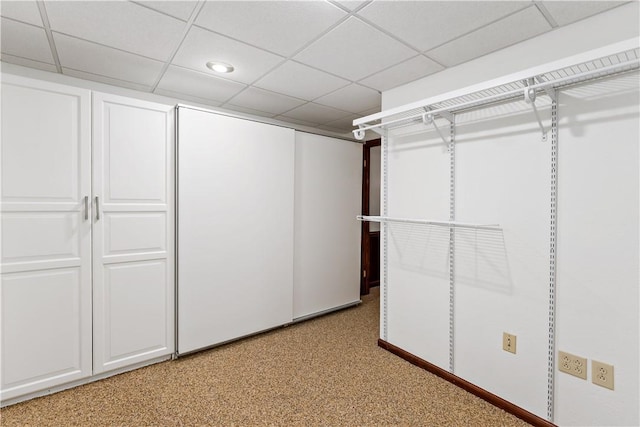 walk in closet with a drop ceiling