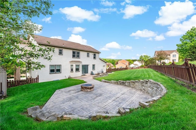 back of house with a patio and an outdoor fire pit