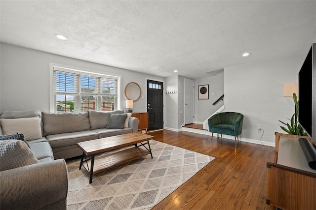 665 Dunster St, Brookline, PA 15226 - living area featuring a textured ceiling, wood finished floors, recessed lighting, and baseboards
