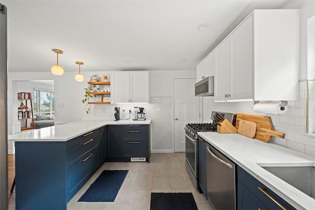 665 Dunster St, Brookline, PA 15226 - kitchen with appliances with stainless steel finishes, a peninsula, white cabinetry, open shelves, and tasteful backsplash