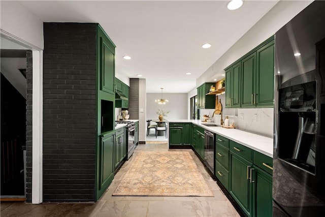 205 Seegar Rd, Upper St Clair, PA 15241 - kitchen featuring green cabinetry, gas range oven, dishwasher, light countertops, and a chandelier