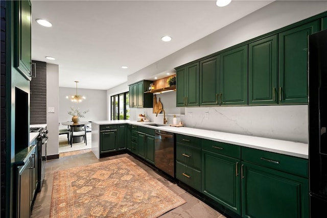 205 Seegar Rd, Upper St Clair, PA 15241 - kitchen with stainless steel appliances, green cabinets, a sink, tasteful backsplash, and light countertops