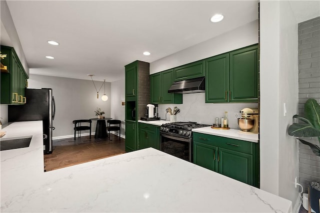 205 Seegar Rd, Upper St Clair, PA 15241 - kitchen with stainless steel gas range, green cabinets, under cabinet range hood, light stone counters, and recessed lighting