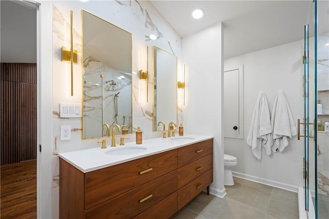 205 Seegar Rd, Upper St Clair, PA 15241 - full bathroom with a marble finish shower, double vanity, toilet, and baseboards