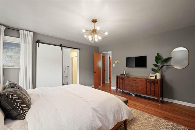 205 Seegar Rd, Upper St Clair, PA 15241 - bedroom featuring wood finished floors, baseboards, a barn door, and a chandelier