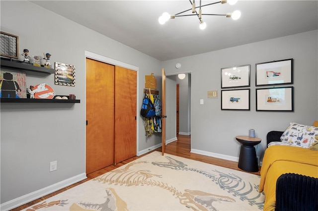 205 Seegar Rd, Upper St Clair, PA 15241 - bedroom with a chandelier, a closet, wood finished floors, and baseboards