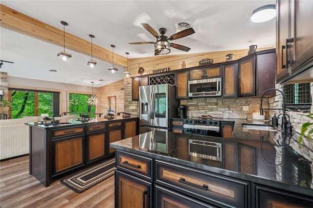 133 Imperial Rd, Hidden Valley, PA 15502 - kitchen featuring stainless steel appliances, a peninsula, wood finished floors, a ceiling fan, and beamed ceiling