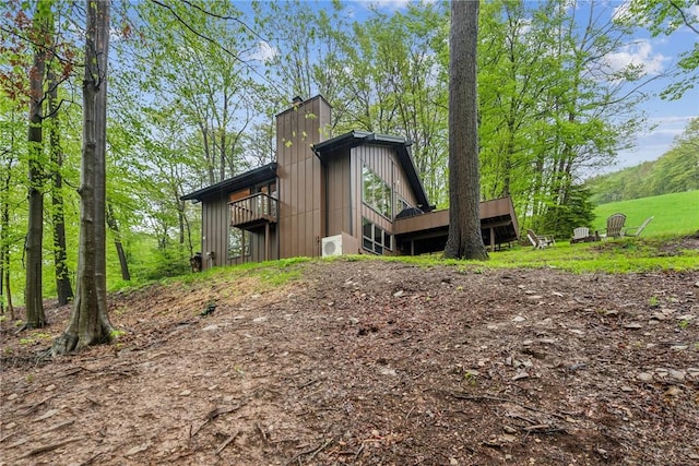 133 Imperial Rd, Hidden Valley, PA 15502 - rear view of house with a chimney and a wooden deck