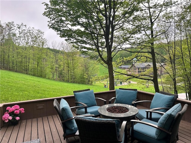 133 Imperial Rd, Hidden Valley, PA 15502 - deck featuring a fire pit, a yard, and a wooded view