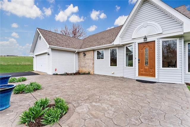 844 Old Millcreek Rd, Hookstown, PA 15050 - rear view of house with asphalt driveway, a shingled roof, and an attached garage