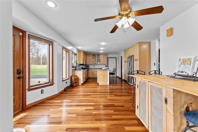 844 Old Millcreek Rd, Hookstown, PA 15050 - kitchen with light wood-style floors, a kitchen island, glass insert cabinets, ceiling fan, and recessed lighting