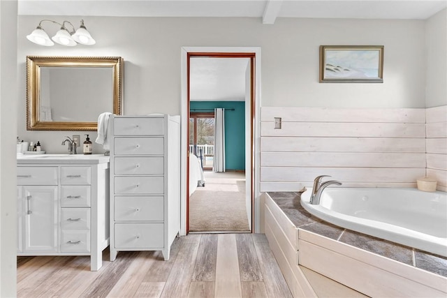 844 Old Millcreek Rd, Hookstown, PA 15050 - bathroom featuring wood finished floors, vanity, and a garden tub