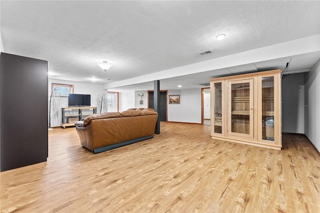 844 Old Millcreek Rd, Hookstown, PA 15050 - living area with light wood-style flooring and a textured ceiling