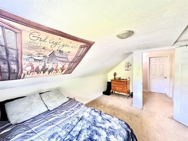carpeted bedroom featuring a textured ceiling, baseboards, and lofted ceiling