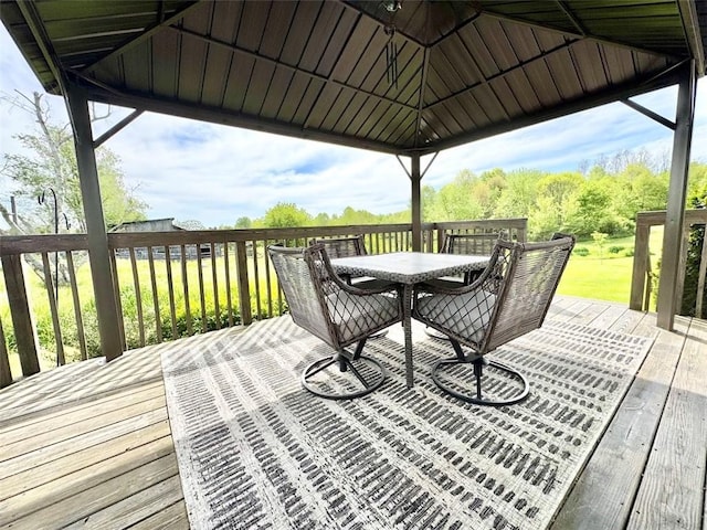deck featuring outdoor dining area