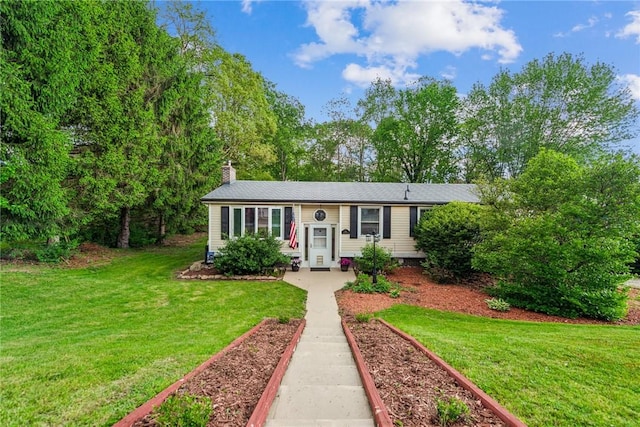 716 Stauffer Ave, Scottdale, PA 15683 - bi-level home featuring a front lawn and a chimney