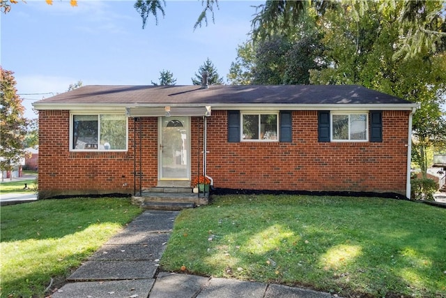 601 Dressel Rd, Shaler, PA 15101 - view of front of house featuring a front yard, brick siding, and entry steps