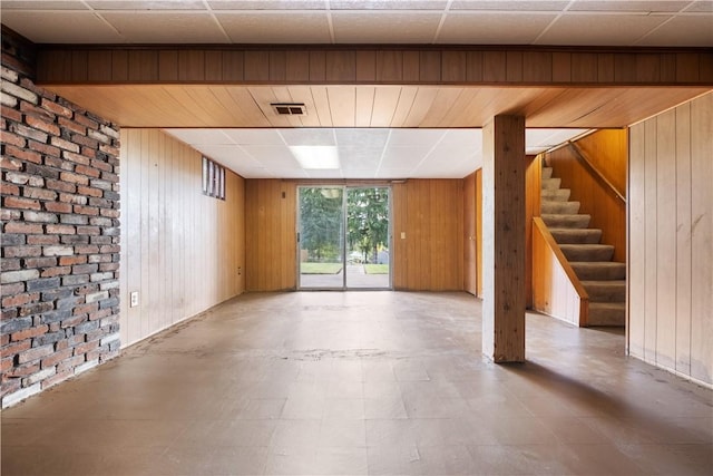 601 Dressel Rd, Shaler, PA 15101 - basement with wood walls, stairs, brick wall, and tile patterned floors