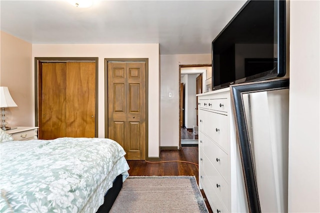 53 Sycamore St, Etna, PA 15223 - bedroom featuring two closets, dark wood-style flooring, and baseboards