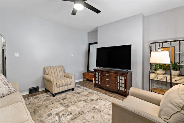 53 Sycamore St, Etna, PA 15223 - living room featuring a ceiling fan, wood finished floors, arched walkways, and baseboards