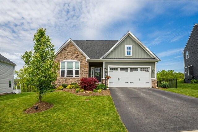 276 Regency Dr, North Strabane, PA 15330 - craftsman-style home featuring stone siding, board and batten siding, asphalt driveway, and an attached garage