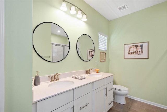 276 Regency Dr, North Strabane, PA 15330 - bathroom with toilet, double vanity, tile patterned floors, and baseboards