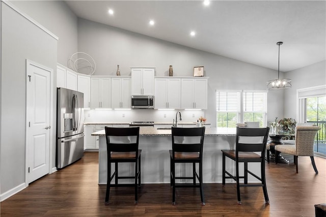 276 Regency Dr, North Strabane, PA 15330 - kitchen featuring appliances with stainless steel finishes, high vaulted ceiling, a kitchen island with sink, white cabinets, and dark wood finished floors