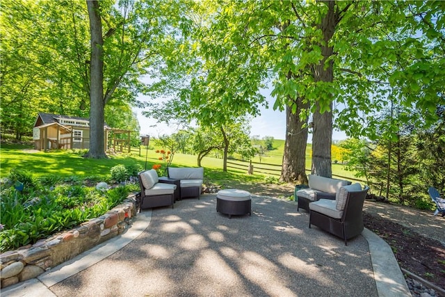 view of patio featuring an outdoor living space and an outdoor structure