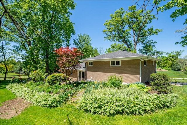 view of property exterior with brick siding
