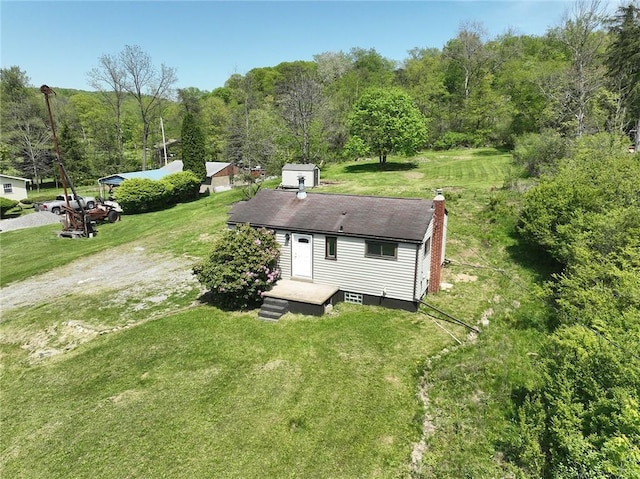 2608 Big Sewickley Creek Rd, Franklin Park, PA 15143 - rear view of house with a chimney, a yard, and a view of trees