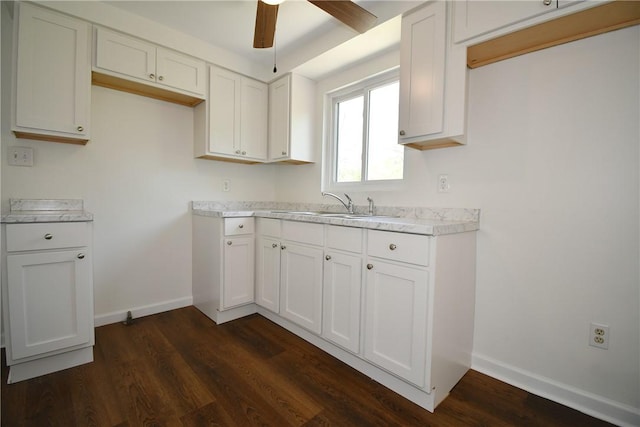 2608 Big Sewickley Creek Rd, Franklin Park, PA 15143 - kitchen with baseboards, ceiling fan, dark wood-style flooring, light countertops, and white cabinetry