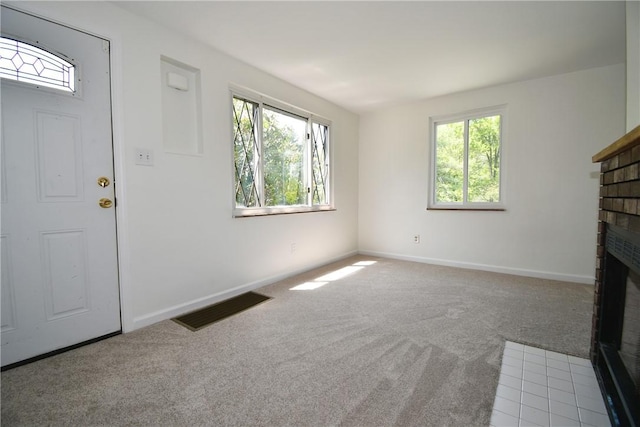 2608 Big Sewickley Creek Rd, Franklin Park, PA 15143 - unfurnished living room with carpet floors, a brick fireplace, and baseboards