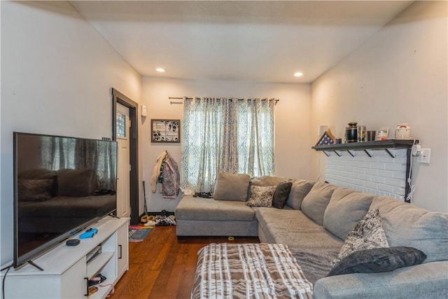 living area featuring dark wood finished floors and recessed lighting