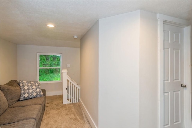 living area with light colored carpet, recessed lighting, and baseboards