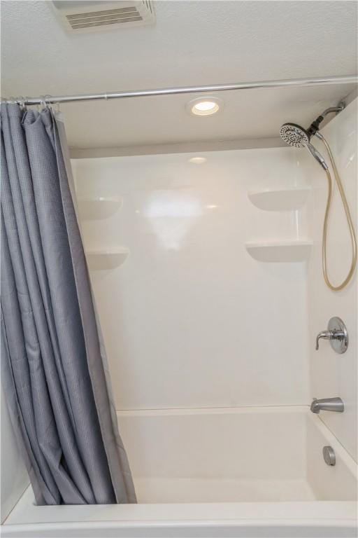full bathroom featuring shower / bath combo and recessed lighting
