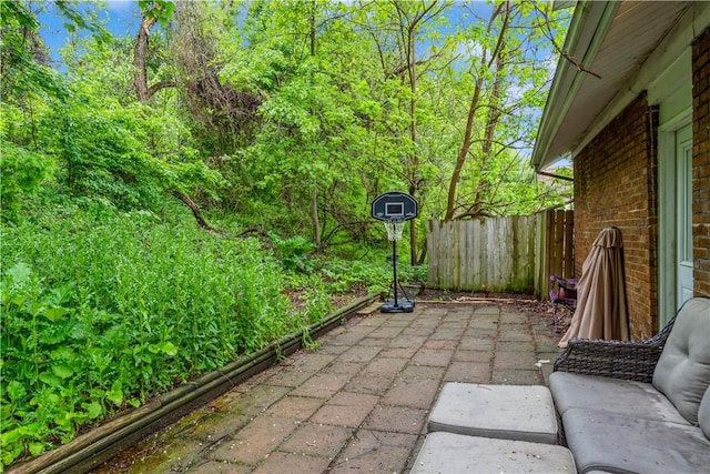 view of patio / terrace featuring fence