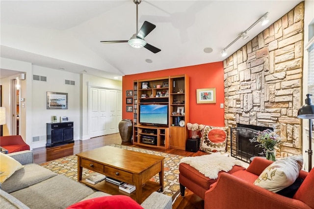 238 Berkeley Way, Monroeville, PA 15146 - living area with wood finished floors, a ceiling fan, a fireplace, vaulted ceiling, and track lighting