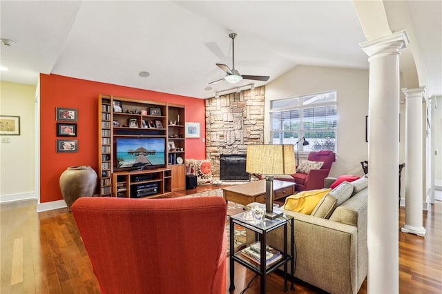 238 Berkeley Way, Monroeville, PA 15146 - living area with decorative columns, ceiling fan, vaulted ceiling, a stone fireplace, and wood finished floors