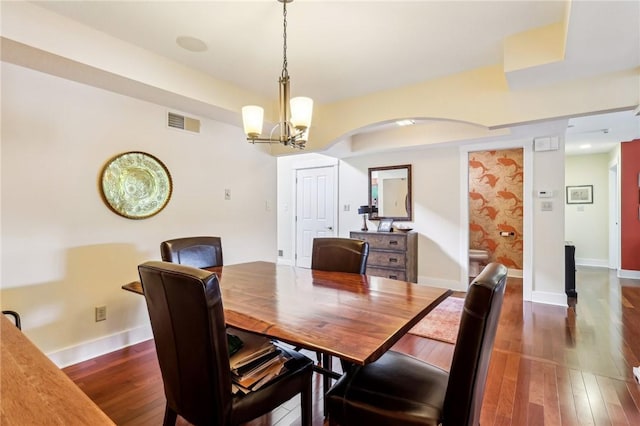 238 Berkeley Way, Monroeville, PA 15146 - dining room with a chandelier, dark wood finished floors, arched walkways, and baseboards