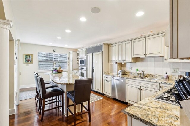 238 Berkeley Way, Monroeville, PA 15146 - kitchen with built in appliances, a sink, dark wood finished floors, recessed lighting, and light stone countertops