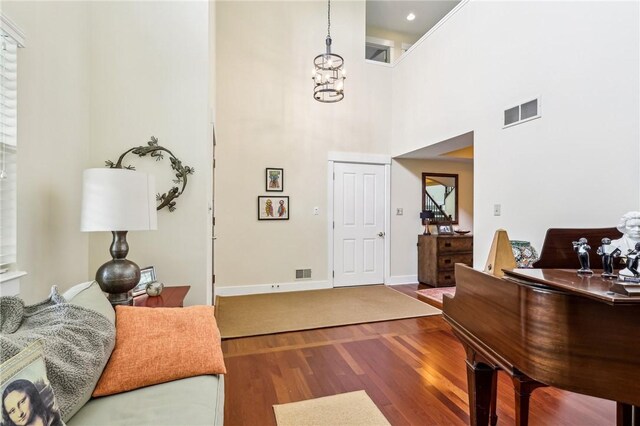 238 Berkeley Way, Monroeville, PA 15146 - entrance foyer with wood finished floors, a high ceiling, baseboards, and a chandelier