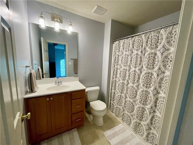 full bathroom with vanity, toilet, a shower with curtain, and tile patterned flooring