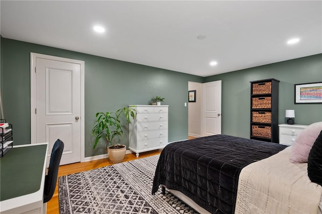 bedroom with light wood-type flooring, recessed lighting, and baseboards